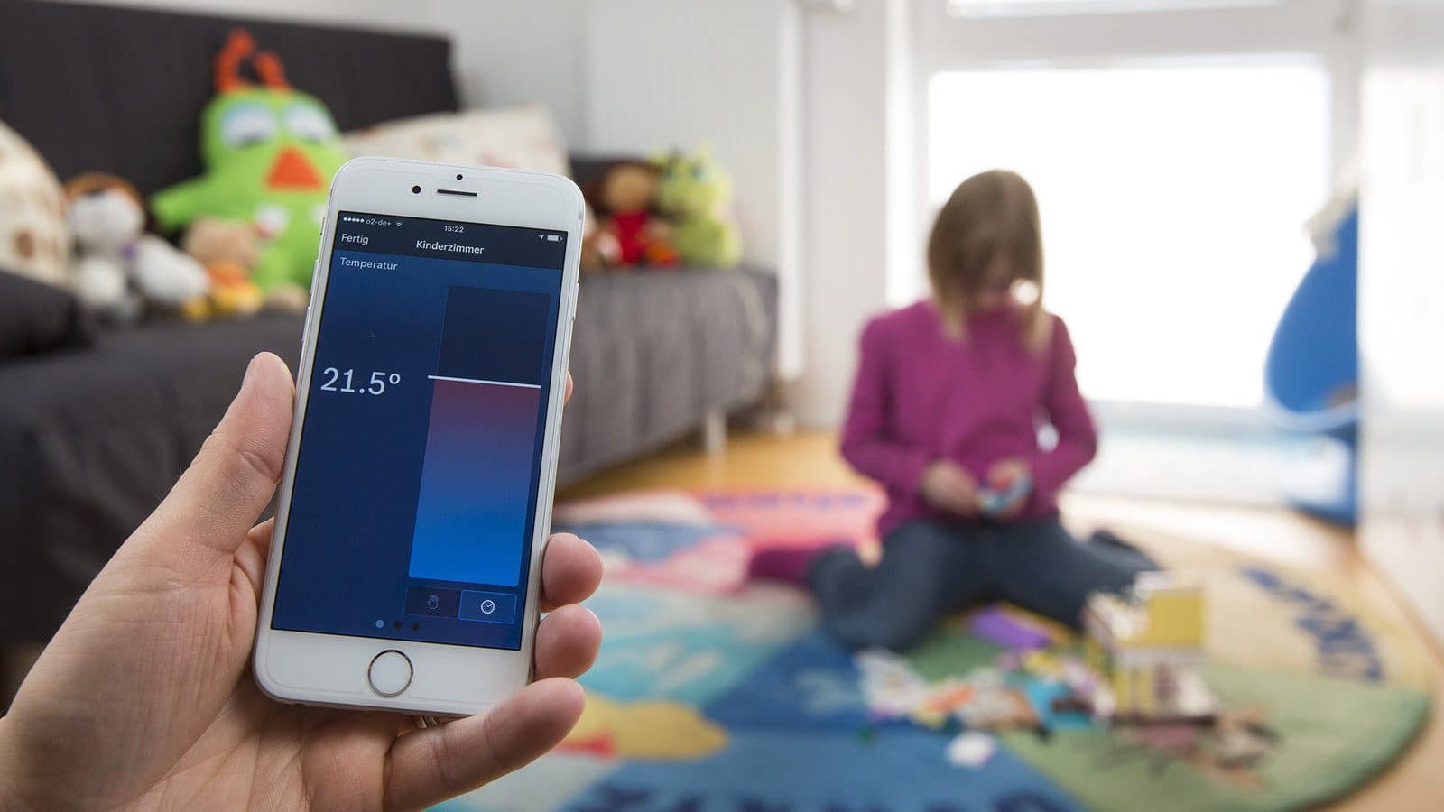 Person chcking his heating system with a smartphone.