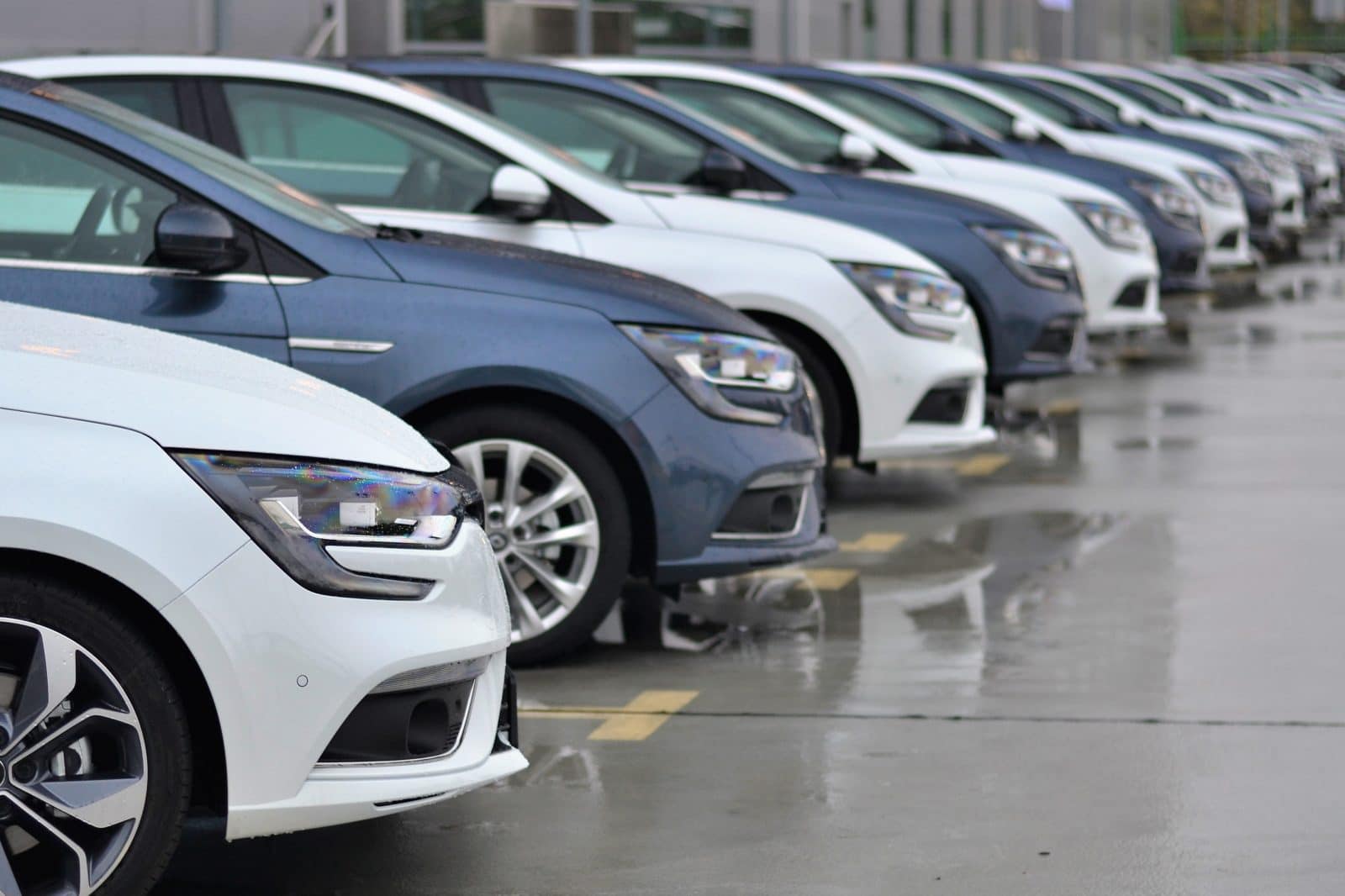 Compact cars parked in a row.